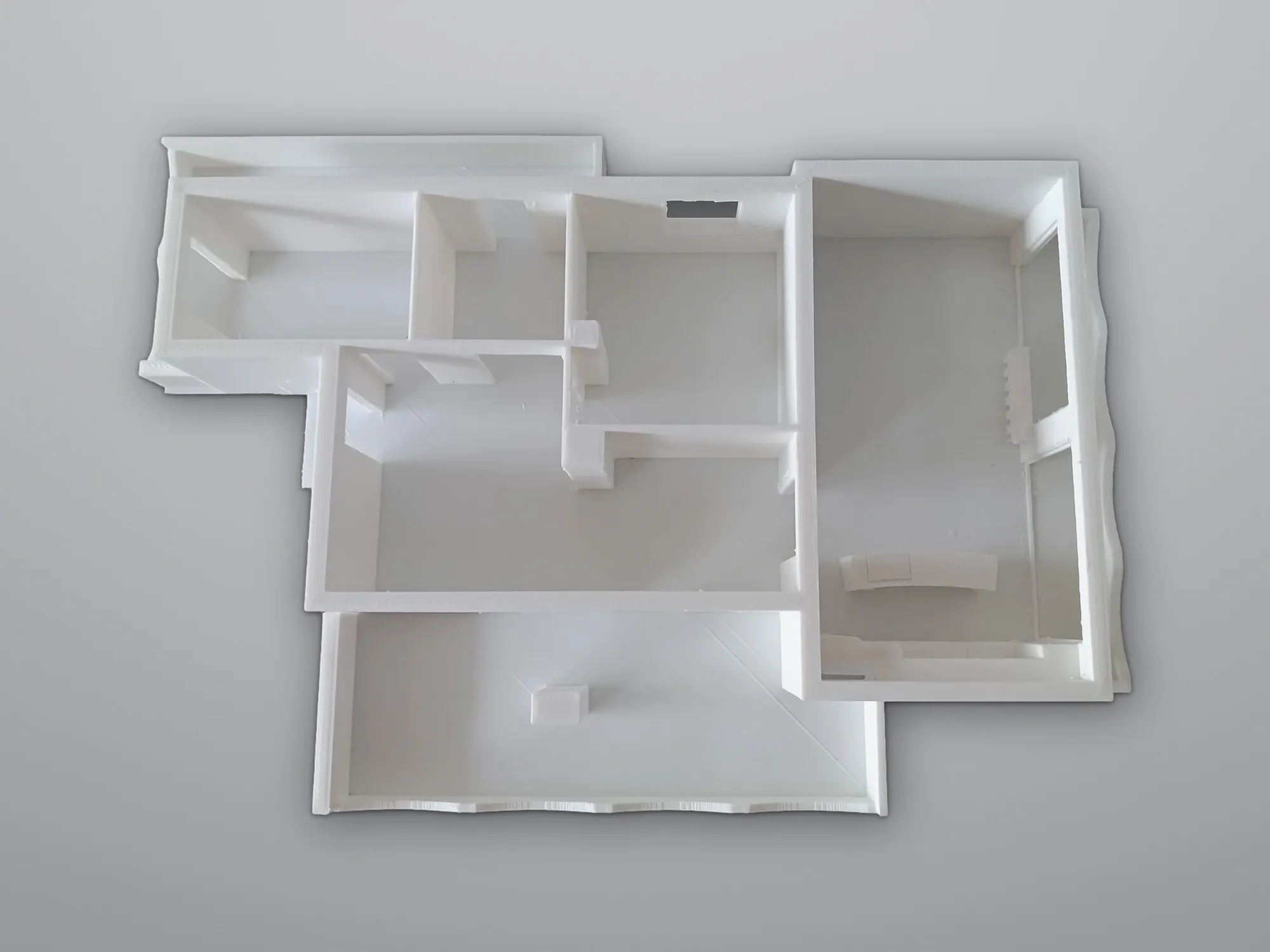 White 3D-printed architectural floor-plan model