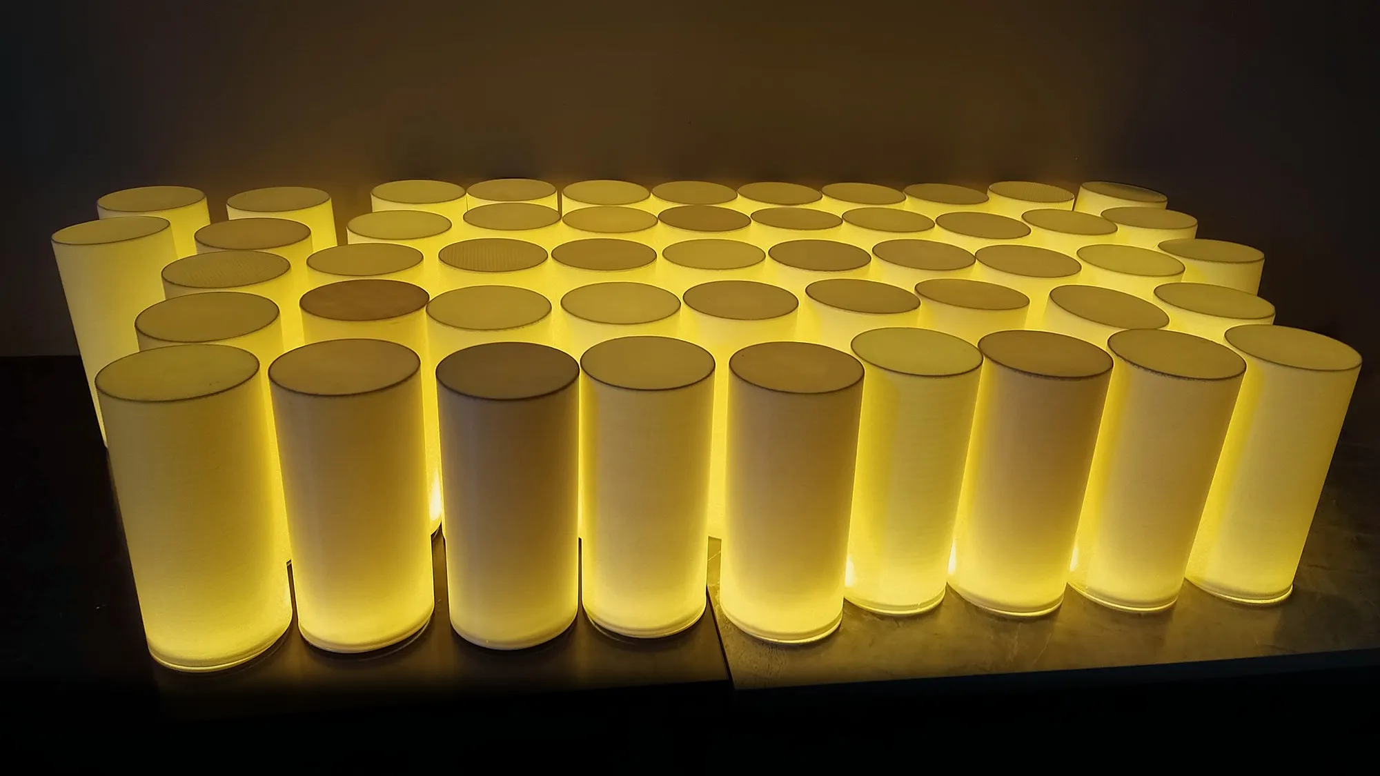 Rows of glowing 3D-printed cylindrical lamps