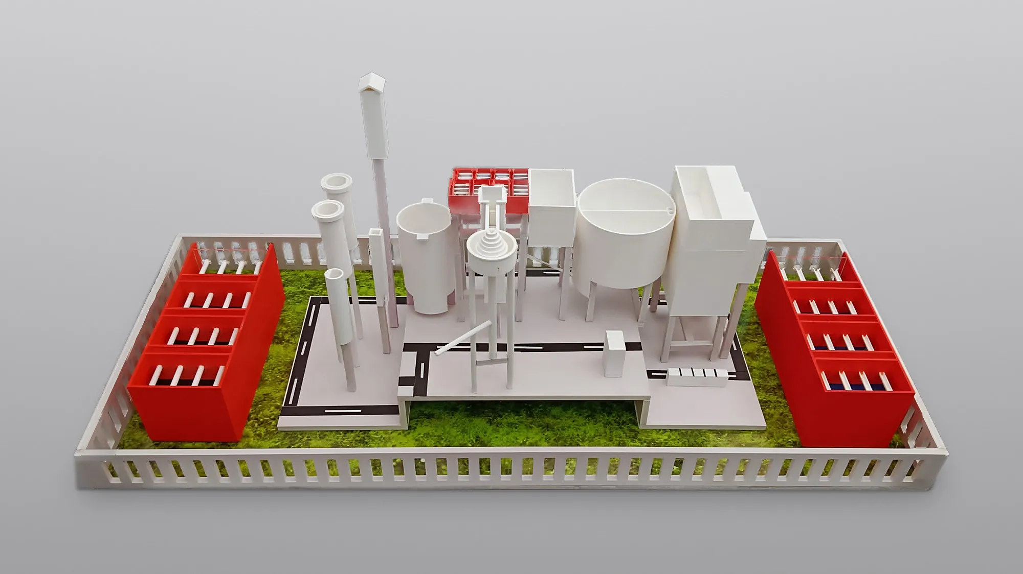 Painted 3D-printed industrial plant scale model with tanks and piping