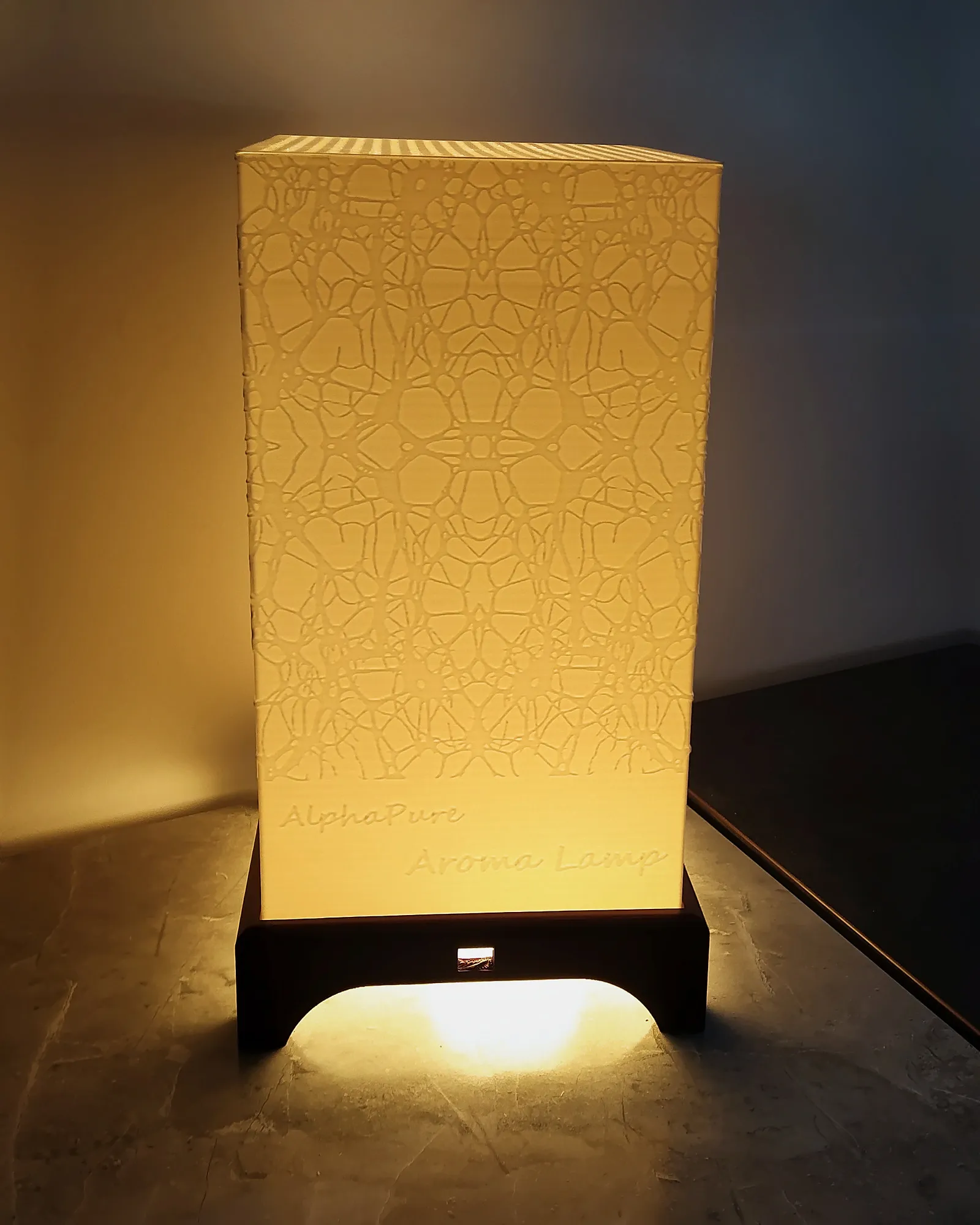 3D-printed lattice-pattern table lamp, lit